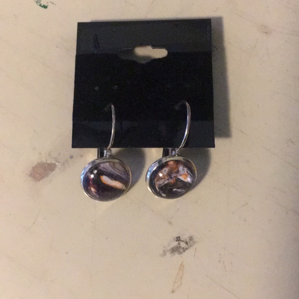 Drop pierced earrings with design under glass